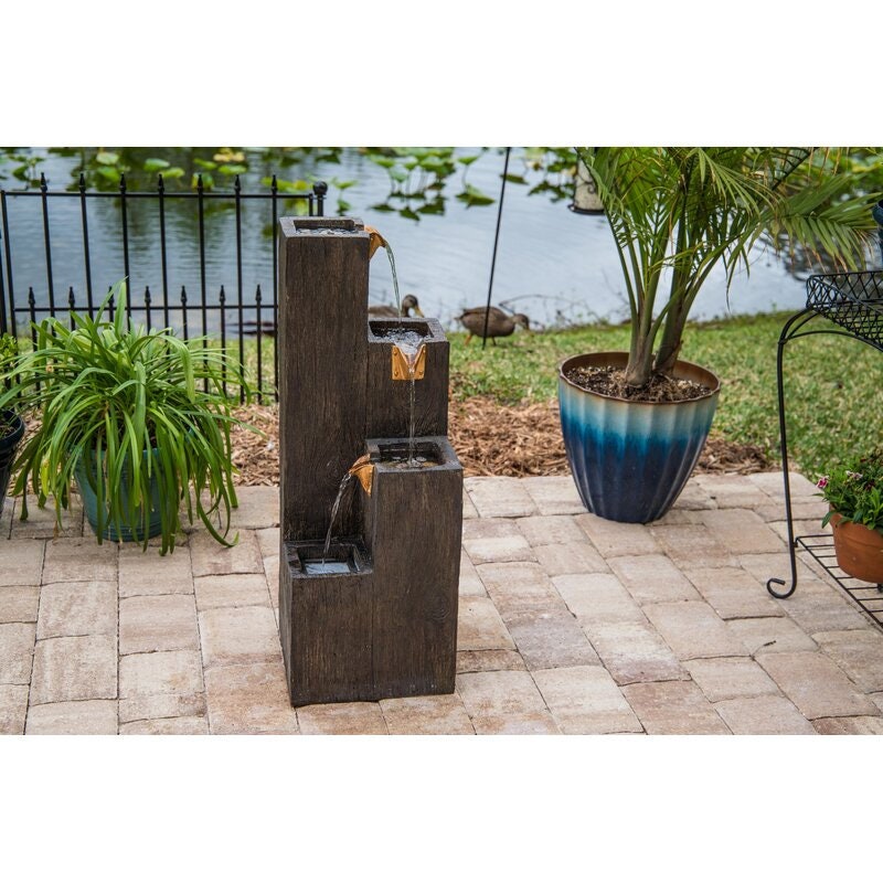 Resin Floor Fountain Perfect To Be Placed in a Garden Filled with Blue Fescue Grass 360-Degree View