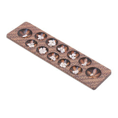 Batik Wood Game Five to Seven Stones and The Game is Played in Turns. Similar to Mancala, Each Player Collects the Stones From One Hole