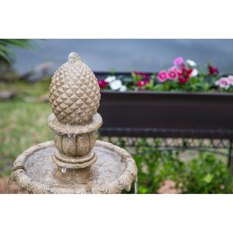 Sandstone Danelle Resin Outdoor Fountain with Light 3-Tiers That Send Water Flowing Pineapple-Shaped Bubbler at Top of a Fountain