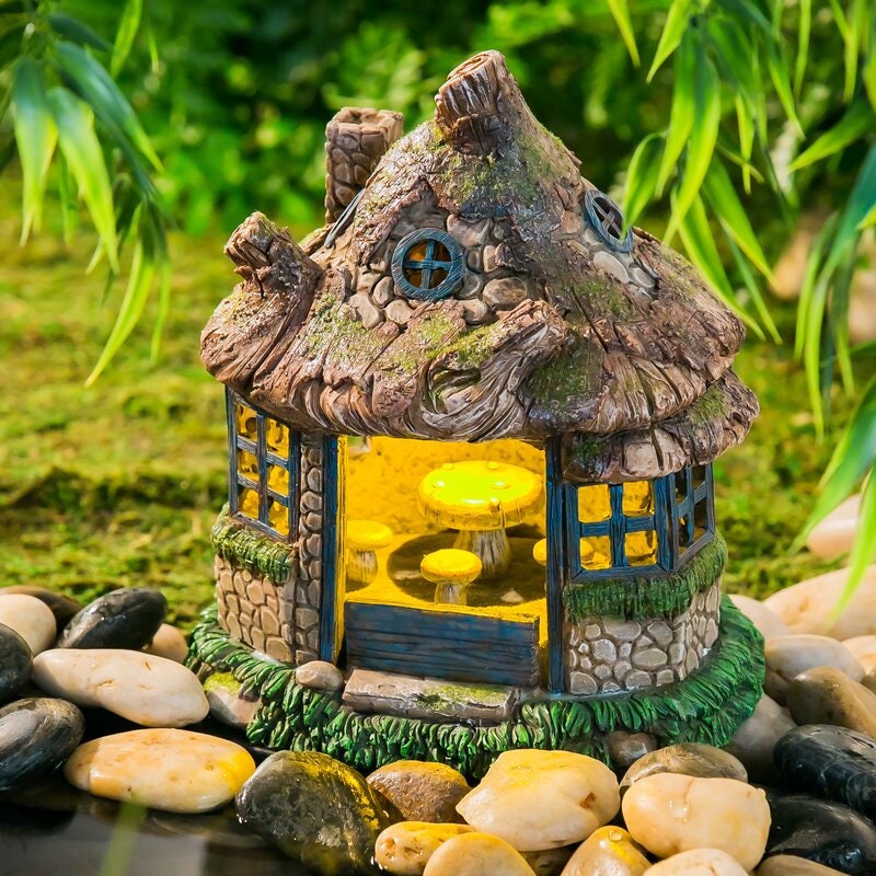 Solar Powered Lawn Ornament Wooden Table and Chairs Inside. The Outside Lantern and Windows Glow At Night with a Ligh
