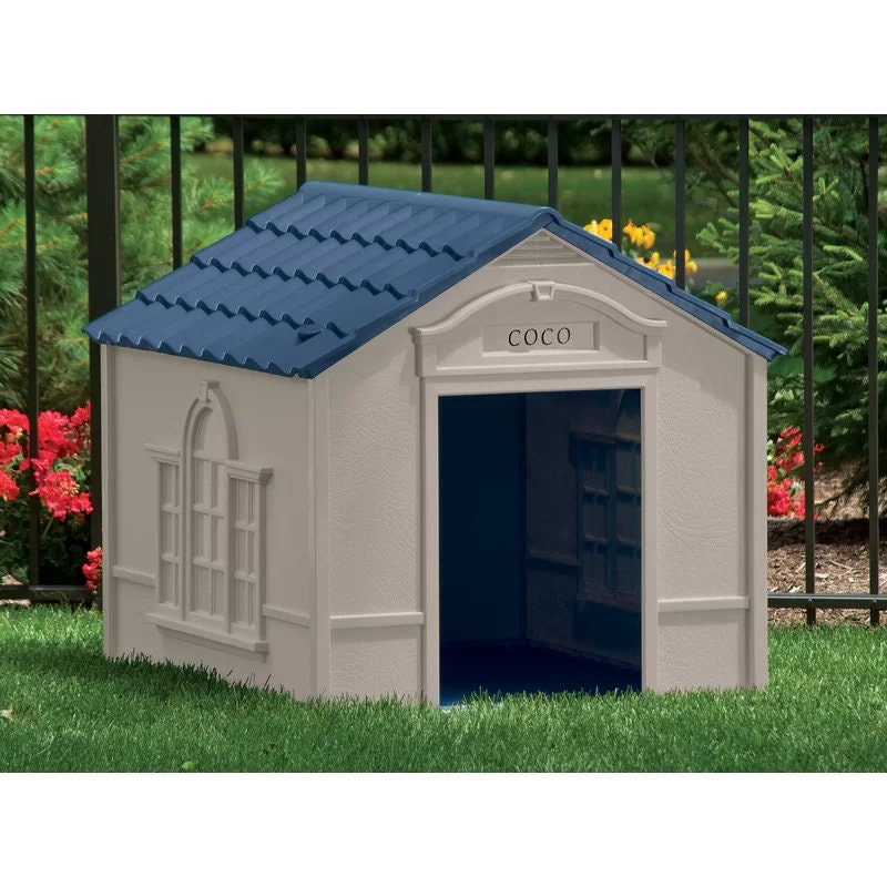 Taupe and Blue Plastic Dog House Dog House is made from durable plastic. The dog house is designed to be staked into the ground to ensure
