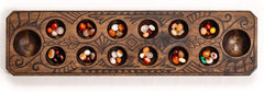 Mancala Set with Wooden Board and Quartz Pebble Playing Pieces, Natural Wood features a beautifully detailed motif
