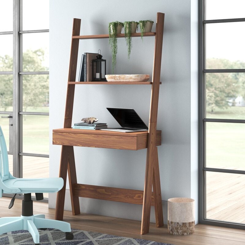 Leaning Ladder Desk Desk Offers A Work Area Open Storage and Decorative Display A Drawer Offers Concealed Storage The Two Shelves Are Fixed