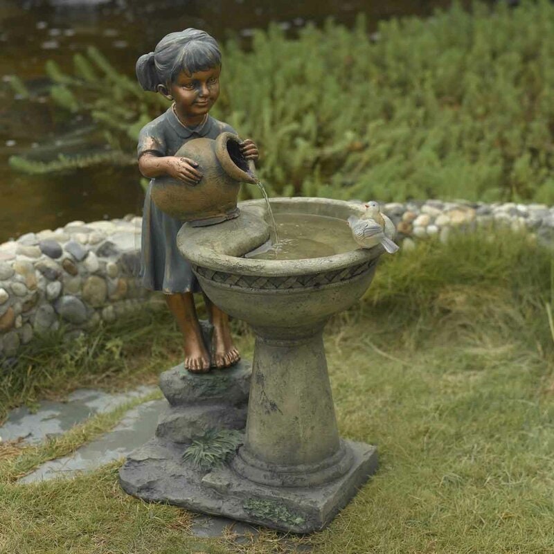 Resin Fiberglass Bird Bath Outdoor Water Fountain A Sweet Young Girl Takes Her Turn At Filling up the Fountain with Her Feathered Friend