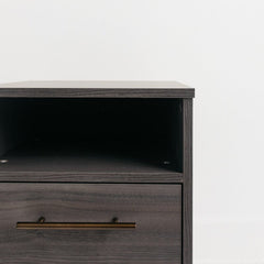 1 - Drawer Nightstand in Warm Gray Creates A Modern Sense of Harmony in your Room Goldtone Handles Add An Authentically Modern Touch