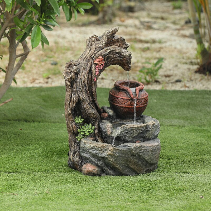 Daulton Resin Tree Stump and Rock Outdoor Fountain