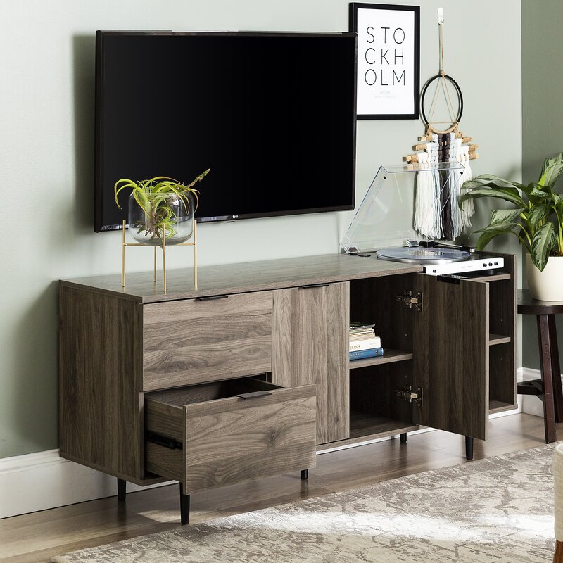 Slate Gray TV Stand for TVs up to 64" Multiple Cubbies on the Right Two Deep Drawers On the Left, and Two Doors that Open up to Additional Shelving