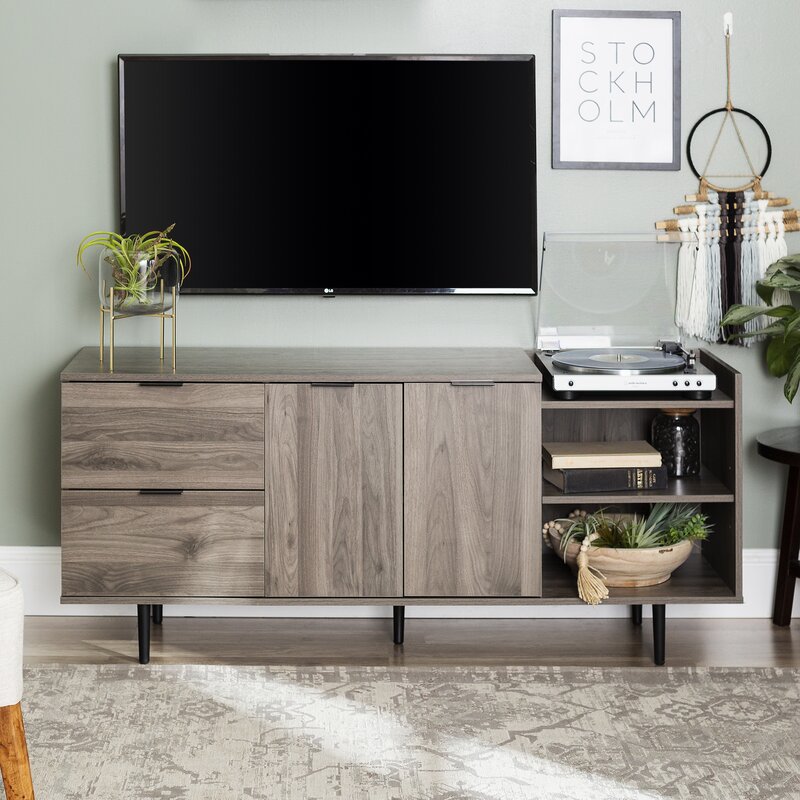 Slate Gray TV Stand for TVs up to 64" Multiple Cubbies on the Right Two Deep Drawers On the Left, and Two Doors that Open up to Additional Shelving